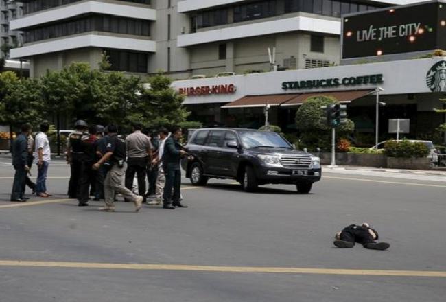 Six dead in serial explosions in Jakarta; suicide bombers, gunmen spotted