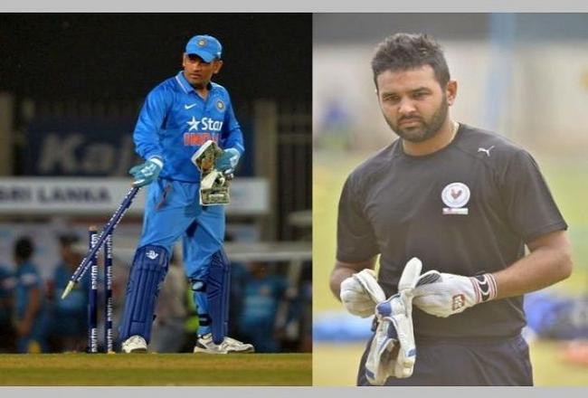 Dhoni suffers spasm, Parthiv called as back up