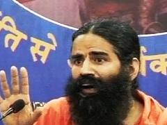 Rajbala cremated, Ramdev vows to continue anti-black money movement